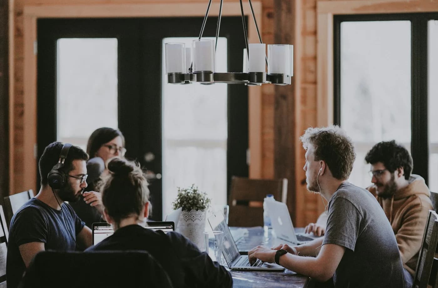 Technology team collaborating around a shared workspace